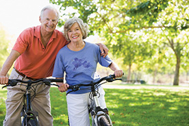 Photo of couple on their bikes. Link to Gifts by Estate Note.