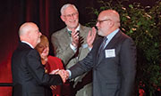 Photo of The Della Pennas congratulate Dr. Ridge and Dr. Greenberg.