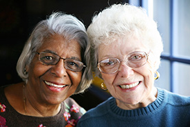 Photo of two women smiling. Link to Life Stage Gift Planner Over Age 70 Situations.